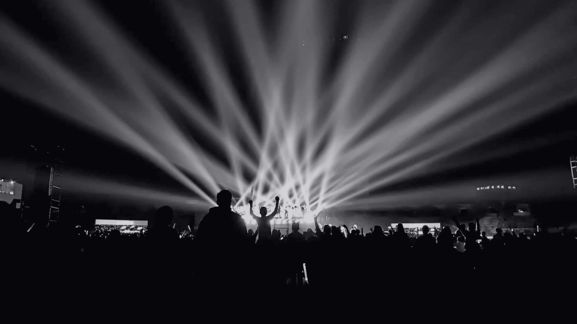 Stage lights over a night crowd